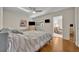 This bedroom features hardwood floors, a ceiling fan and a built-in bookshelf at 1511 Chestnut Ave, Winter Park, FL 32789