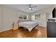 This bedroom features hardwood floors, a ceiling fan and bright windows at 1511 Chestnut Ave, Winter Park, FL 32789