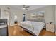 Cozy bedroom features hardwood floors, a ceiling fan and bright windows at 1511 Chestnut Ave, Winter Park, FL 32789