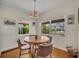 Bright dining area featuring hardwood floors, a round table, and abundant natural light at 1511 Chestnut Ave, Winter Park, FL 32789