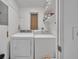 Bright laundry room with washer, dryer and shelf for storage at 1511 Chestnut Ave, Winter Park, FL 32789