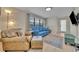 Comfortable living room features bright furniture and a large window that brings in natural light at 1511 Chestnut Ave, Winter Park, FL 32789