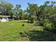 Lush backyard with plentiful green space, perfect for outdoor activities and a peaceful escape at 1526 Cordova Ave, Holly Hill, FL 32117