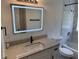 Updated bathroom features a granite vanity with a lit mirror and a shower and tub combination at 1526 Cordova Ave, Holly Hill, FL 32117