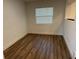 Empty bedroom featuring a window and new wood flooring at 1526 Cordova Ave, Holly Hill, FL 32117