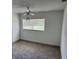 Bedroom features new carpet, ceiling fan, and lots of natural light at 1526 Cordova Ave, Holly Hill, FL 32117