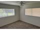 This bedroom has windows that provide natural light and new carpeting at 1526 Cordova Ave, Holly Hill, FL 32117