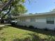 Charming single-story home featuring a well-maintained lawn and mature trees, exuding curb appeal and tranquility at 1526 Cordova Ave, Holly Hill, FL 32117