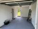 Spacious garage with an open door leading to the backyard at 1526 Cordova Ave, Holly Hill, FL 32117