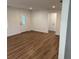 This living room features vinyl wood flooring and provides a spacious atmosphere at 1526 Cordova Ave, Holly Hill, FL 32117