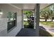 View from the porch, showcasing the exterior and a glimpse of the surrounding landscape at 1526 Cordova Ave, Holly Hill, FL 32117