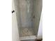This shower features marble tiling and pebble floor at 1526 Cordova Ave, Holly Hill, FL 32117