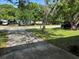 Street view capturing the neighborhood setting with mature trees at 1526 Cordova Ave, Holly Hill, FL 32117