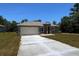 Beautiful single-story home with a two-car garage and a well-maintained front lawn, ideal for suburban living at 15380 Sw 60Th Cir, Ocala, FL 34473