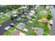 Houses with docks along a river, lush lawns and streets create a vibrant community at 1639 Yellow Brick Rd, Astor, FL 32102