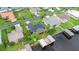 Aerial view of a home with a lush green lawn, a wooden deck, and a private boat dock on the water at 1639 Yellow Brick Rd, Astor, FL 32102