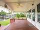 Covered back porch with scenic views, perfect for enjoying the outdoors at 1639 Yellow Brick Rd, Astor, FL 32102