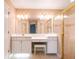 Bathroom showcasing a vanity with a makeup counter and a glass-enclosed shower at 1639 Yellow Brick Rd, Astor, FL 32102