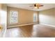 Bedroom featuring wood-look floors and large windows providing ample natural light at 1639 Yellow Brick Rd, Astor, FL 32102