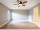 Spacious bedroom with a ceiling fan, natural lighting, and neutral paint at 1639 Yellow Brick Rd, Astor, FL 32102