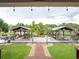 Picturesque waterfront dock with covered seating areas and lush landscaping at 1639 Yellow Brick Rd, Astor, FL 32102