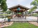 Charming dockside retreat with hanging chairs and a bar area, perfect for waterfront relaxation at 1639 Yellow Brick Rd, Astor, FL 32102