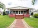 Charming home with a covered front porch and walkway, nestled on a lush lawn at 1639 Yellow Brick Rd, Astor, FL 32102