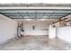 Spacious garage with ample room for storage and parking with convenient shelving at 1639 Yellow Brick Rd, Astor, FL 32102