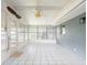Bright sunroom with white paneling, tile floors, and plenty of natural light at 1639 Yellow Brick Rd, Astor, FL 32102