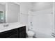 Well-lit bathroom featuring a vanity with sink, shower, and bathtub combination for everyday comfort at 1978 J Lawson Blvd, Orlando, FL 32824
