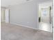 Bedroom with neutral walls and carpet, featuring a door to the Primary bath at 1978 J Lawson Blvd, Orlando, FL 32824