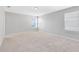 Spacious bedroom with neutral walls, carpet, three windows, and white trim at 1978 J Lawson Blvd, Orlando, FL 32824