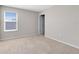 Comfortable bedroom with soft carpeting, window view, and a tranquil ambiance for peaceful nights at 1978 J Lawson Blvd, Orlando, FL 32824