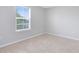 Bright bedroom featuring plush carpeting, large window, and neutral colors for a restful retreat at 1978 J Lawson Blvd, Orlando, FL 32824