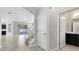 Bright foyer with tiled floors, leading to staircase and a glimpse of the open-concept living area at 1978 J Lawson Blvd, Orlando, FL 32824