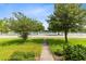 Landscaped front yard overlooking lake at 1978 J Lawson Blvd, Orlando, FL 32824