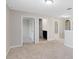 Hallway featuring neutral walls and carpet, with doors leading to other rooms at 1978 J Lawson Blvd, Orlando, FL 32824