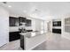 Modern kitchen with granite countertops, stainless steel appliances, and dark cabinetry at 1978 J Lawson Blvd, Orlando, FL 32824