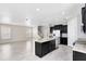 Bright kitchen boasting granite counters, stainless steel appliances and an island with seating for modern living at 1978 J Lawson Blvd, Orlando, FL 32824
