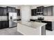 Modern kitchen with granite countertops, stainless steel appliances, and dark cabinetry at 1978 J Lawson Blvd, Orlando, FL 32824