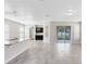 Open-concept living area with tiled floors and sliding glass doors to the outdoor space at 1978 J Lawson Blvd, Orlando, FL 32824