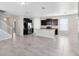 Open floorplan with stainless steel appliances, dark cabinets, and plenty of natural light at 1978 J Lawson Blvd, Orlando, FL 32824