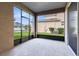 Cozy screened porch offering a private outdoor space to unwind and enjoy the pleasant neighborhood view at 1978 J Lawson Blvd, Orlando, FL 32824