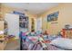 Bedroom featuring toys, Paw Patrol decor, an open closet, and doorway into another room at 205 W Division St, Deland, FL 32720