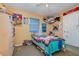Bedroom featuring stuffed animals in a hammock, bright colors, and decoratively colorful items at 205 W Division St, Deland, FL 32720