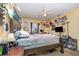 Cozy bedroom featuring a ceiling fan, carpeted floors and an open window at 205 W Division St, Deland, FL 32720