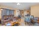 Comfortable living room featuring tile floors, ceiling fan and multiple seating arrangements at 205 W Division St, Deland, FL 32720