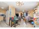 Open-concept living area with tile flooring connecting kitchen and living space at 205 W Division St, Deland, FL 32720