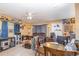 Inviting living room featuring tile floors, ceiling fan and multiple seating arrangements at 205 W Division St, Deland, FL 32720