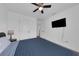 Bright bedroom featuring a ceiling fan, tv, and neutral colors at 2210 Derwent Dr, Davenport, FL 33896